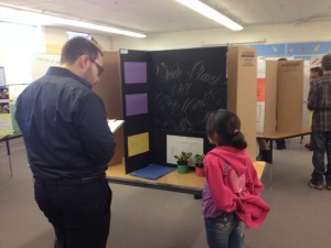 Employee supporting 5th Grade Science Fair at Will Rogers Elementary in Colorado Springs, Colorado.